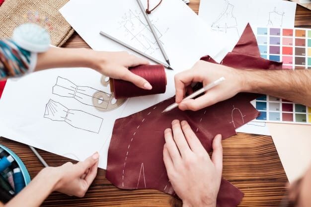 Garment production environment where both private-label and custom-manufactured pieces flow through the same factory floor before being routed to brand-specific finishing.