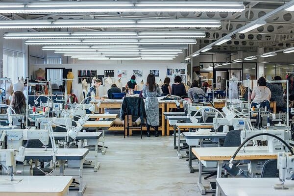 Sample room with rows of sewing machines