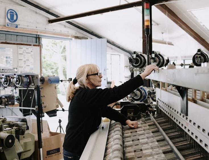 Interior of a traditional vertically integrated woollen mill, illustrating the kind of yarn-to-finish operation typical of US knit mills.