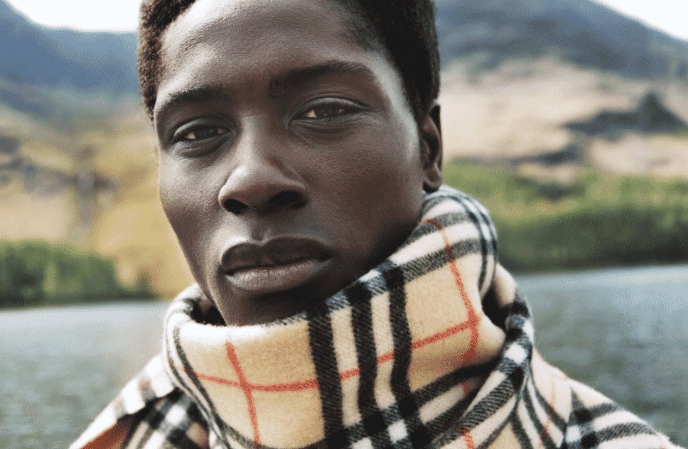 Burberry brand image showcasing the iconic check pattern and trench coat heritage.