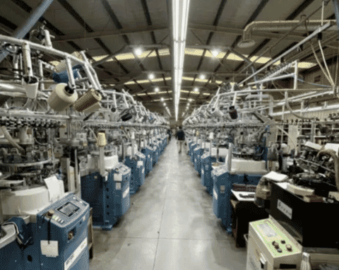 Rows of circular knitting machines on a knitting floor