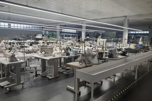 Empty sewing floor with machines and a conveyor