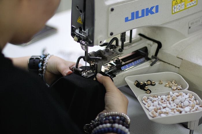 Portuguese textile cluster scene showing the regional sourcing context where GOTS, OEKO-TEX, GRS, and Bluesign certifications are increasingly common.