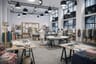 Development studio with cutting tables, fabrics and dress forms