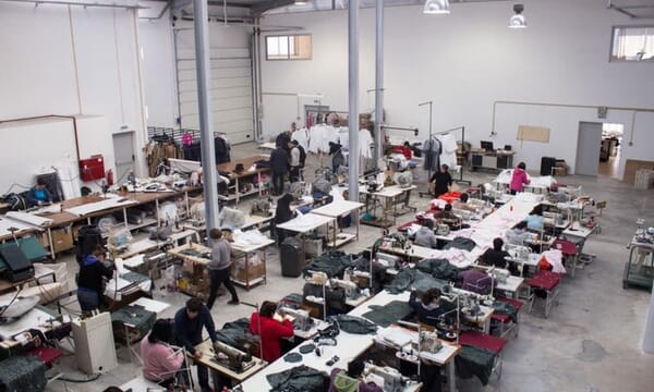 Sewing room seen from above with operators at every station