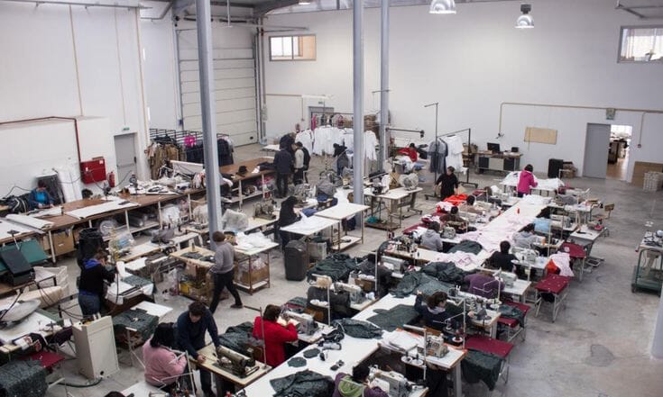 Sewing room seen from above with operators at every station