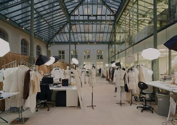 Sampling atelier with dress forms under a skylight