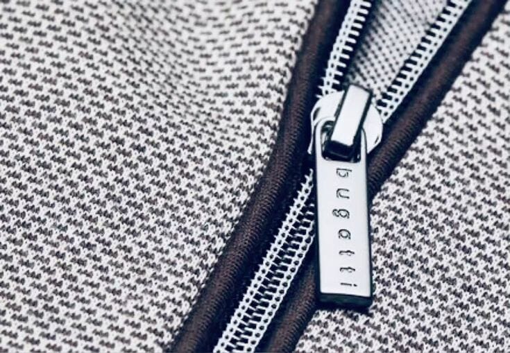 YKK metal zipper detail on premium denim and outerwear