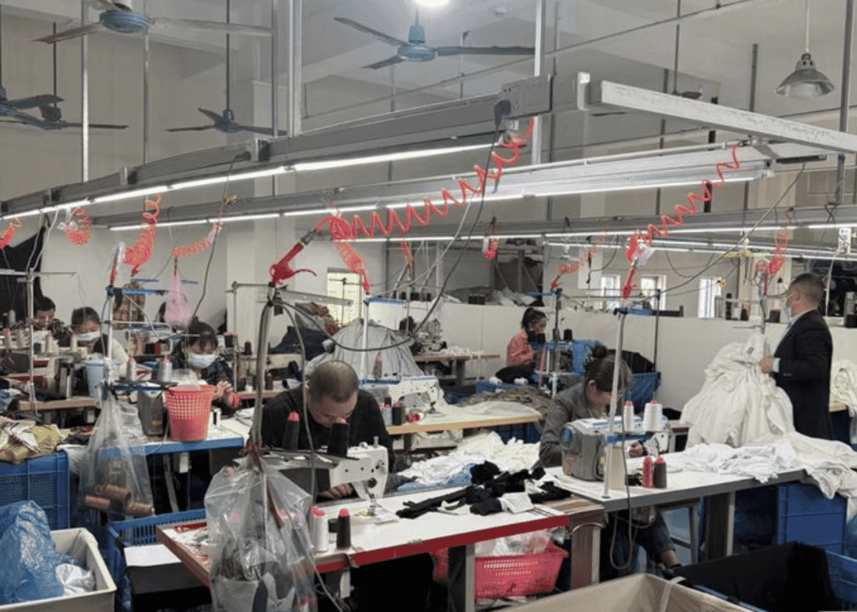 Factory worker operating machinery on a production floor