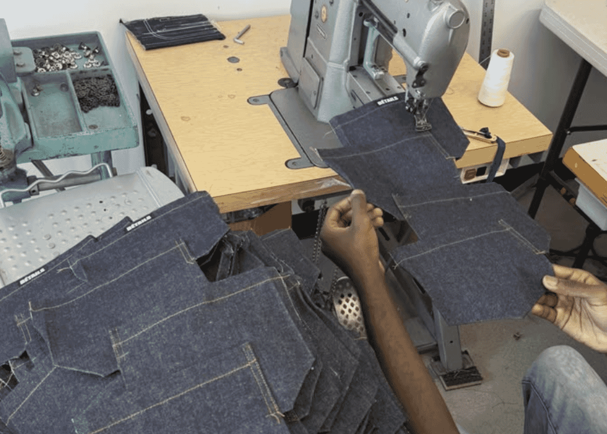Industrial sewing machines on a factory line