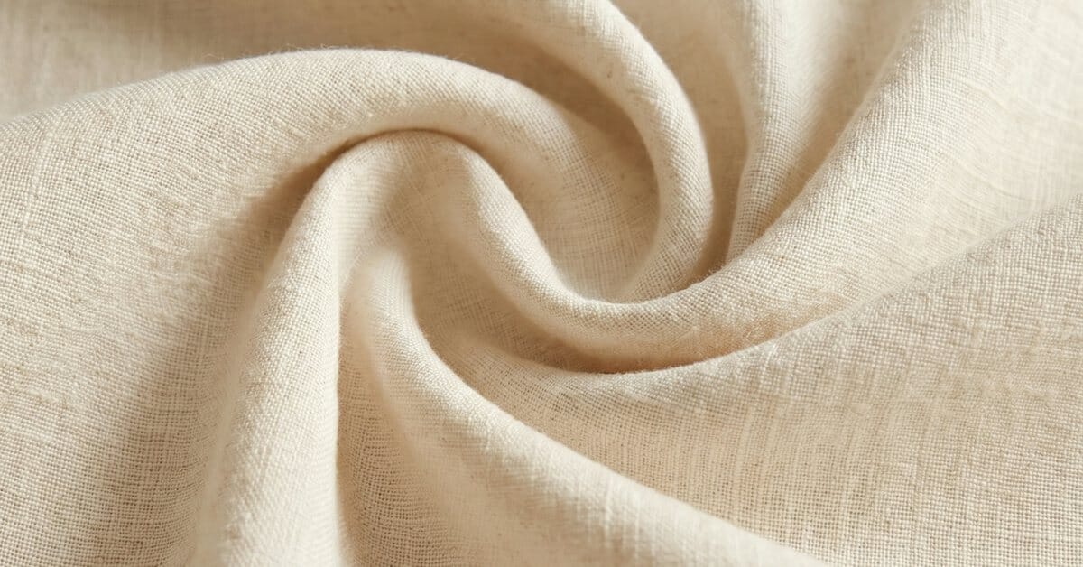 Linen fabric close-up showing the slub and open weave