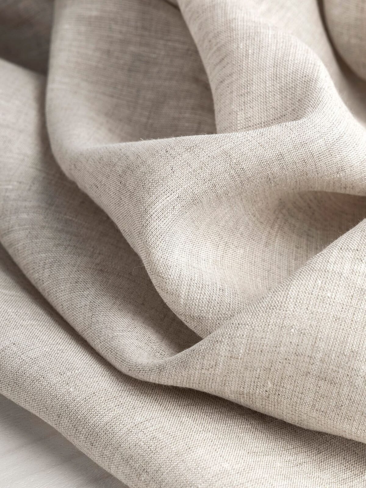 Linen fabric close-up showing the slub and open weave