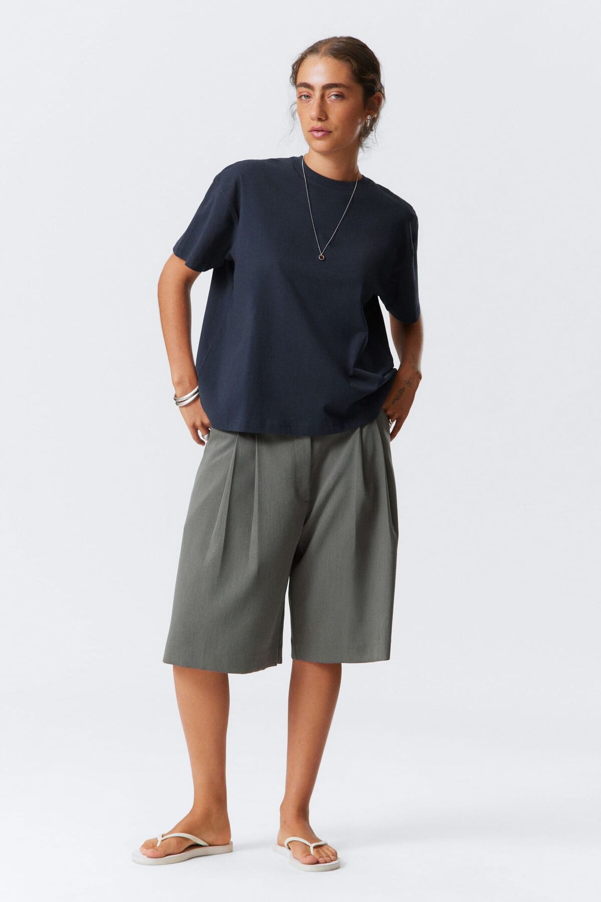 Short-sleeve jersey tee laid flat to show the side seam