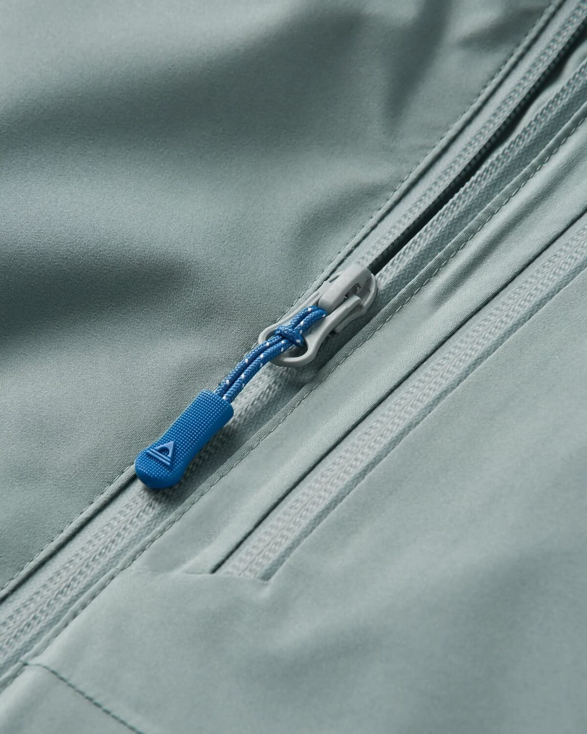 Technical performance fabric close-up showing the face and membrane