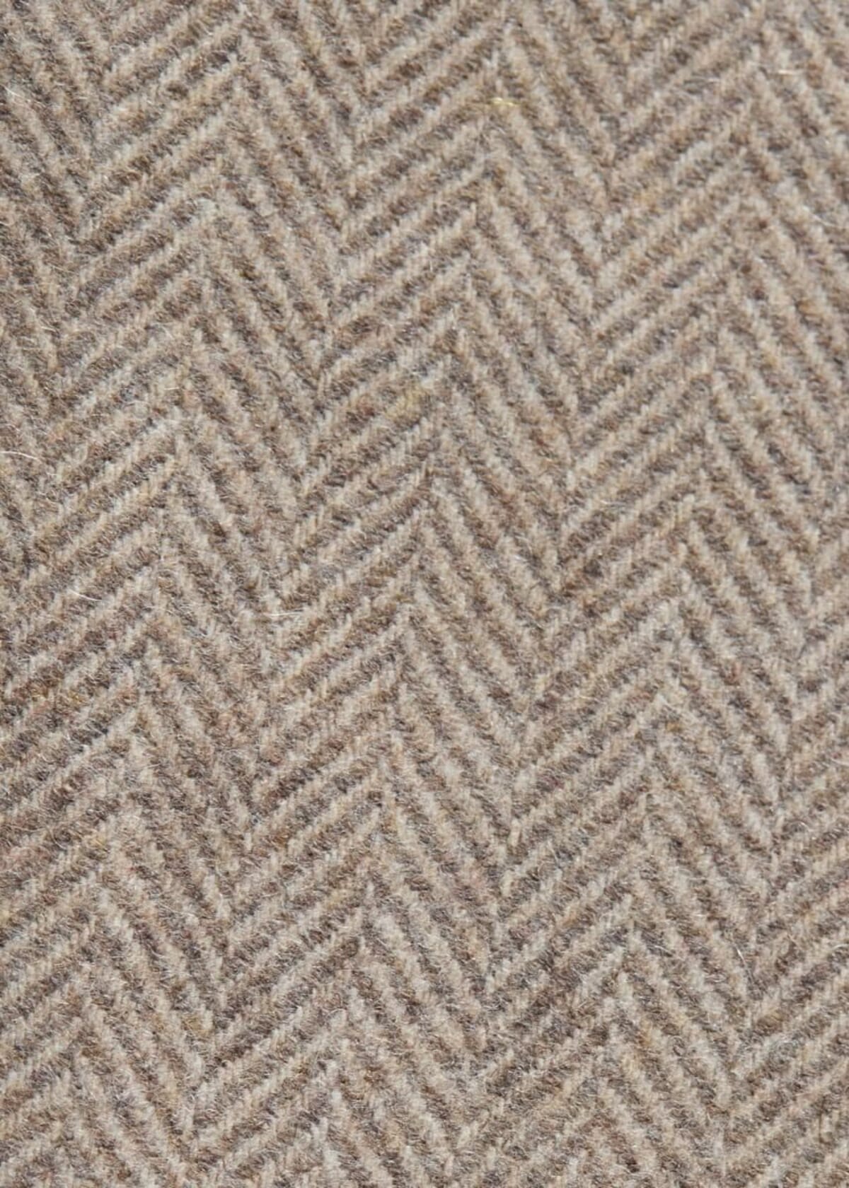 Wool tweed close-up showing the fleck and handle