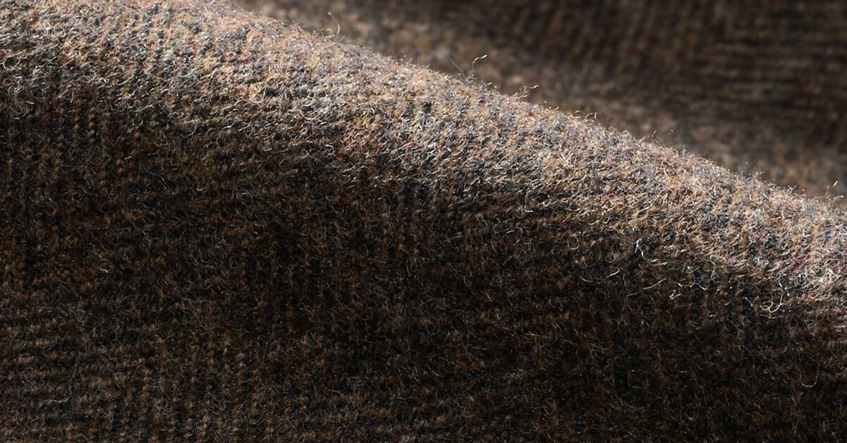Wool tweed close-up showing the fleck and handle