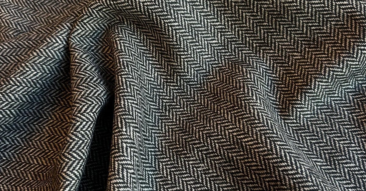 Wool tweed close-up showing the fleck and handle