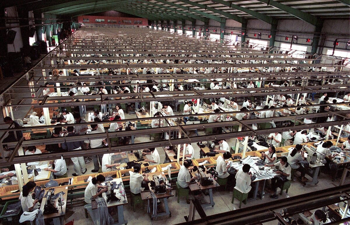 Garment sewing floor with rows of lockstitch machines