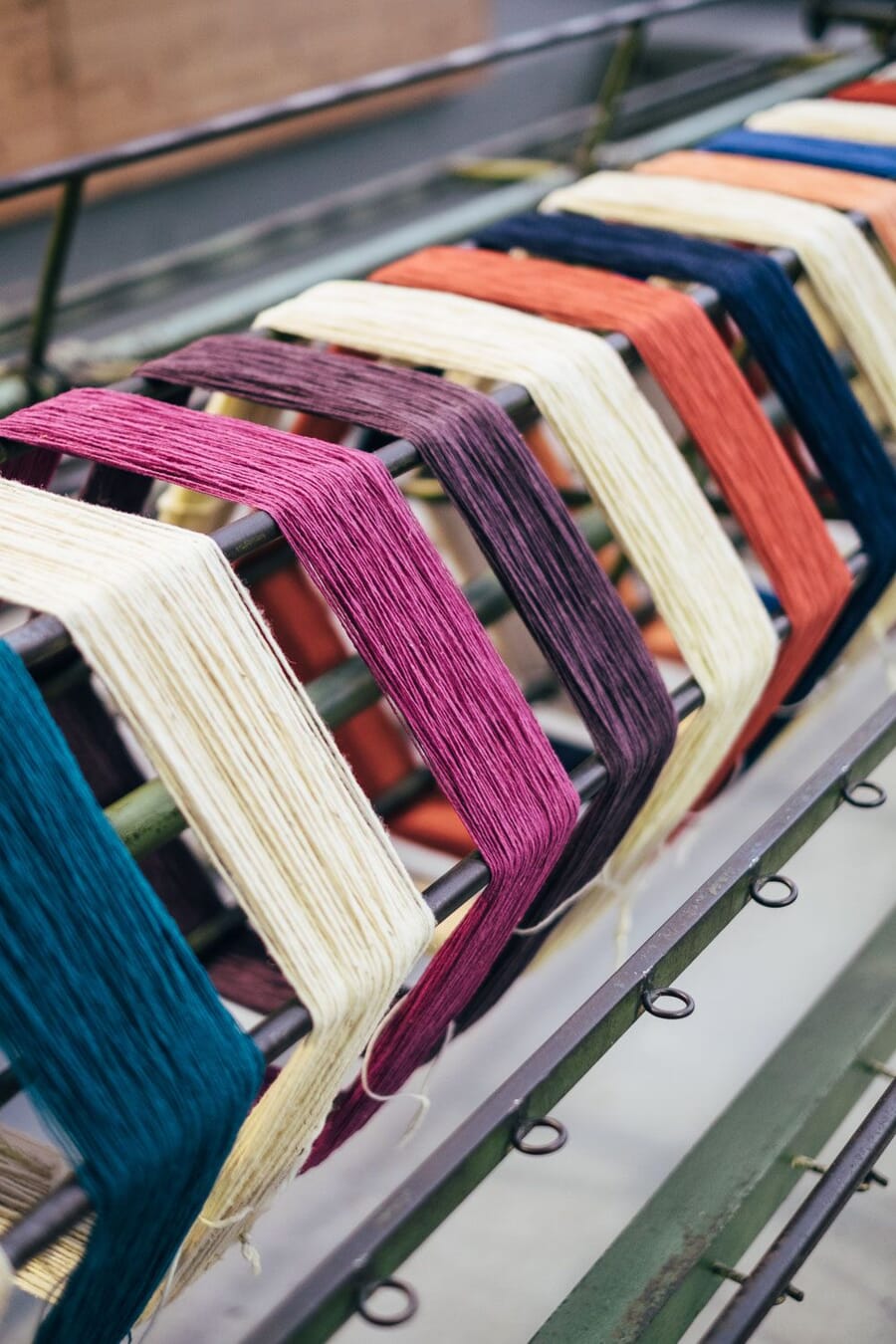 Coloured wool yarn on a warping frame in a wool mill in Portugal