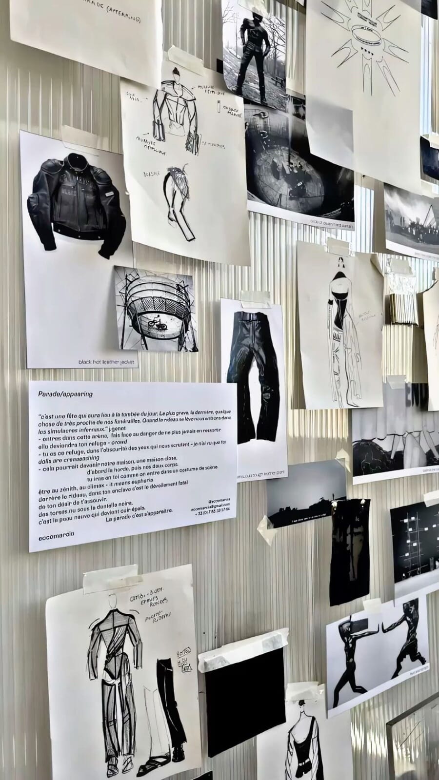 Sketches and reference photos taped to a white studio wall