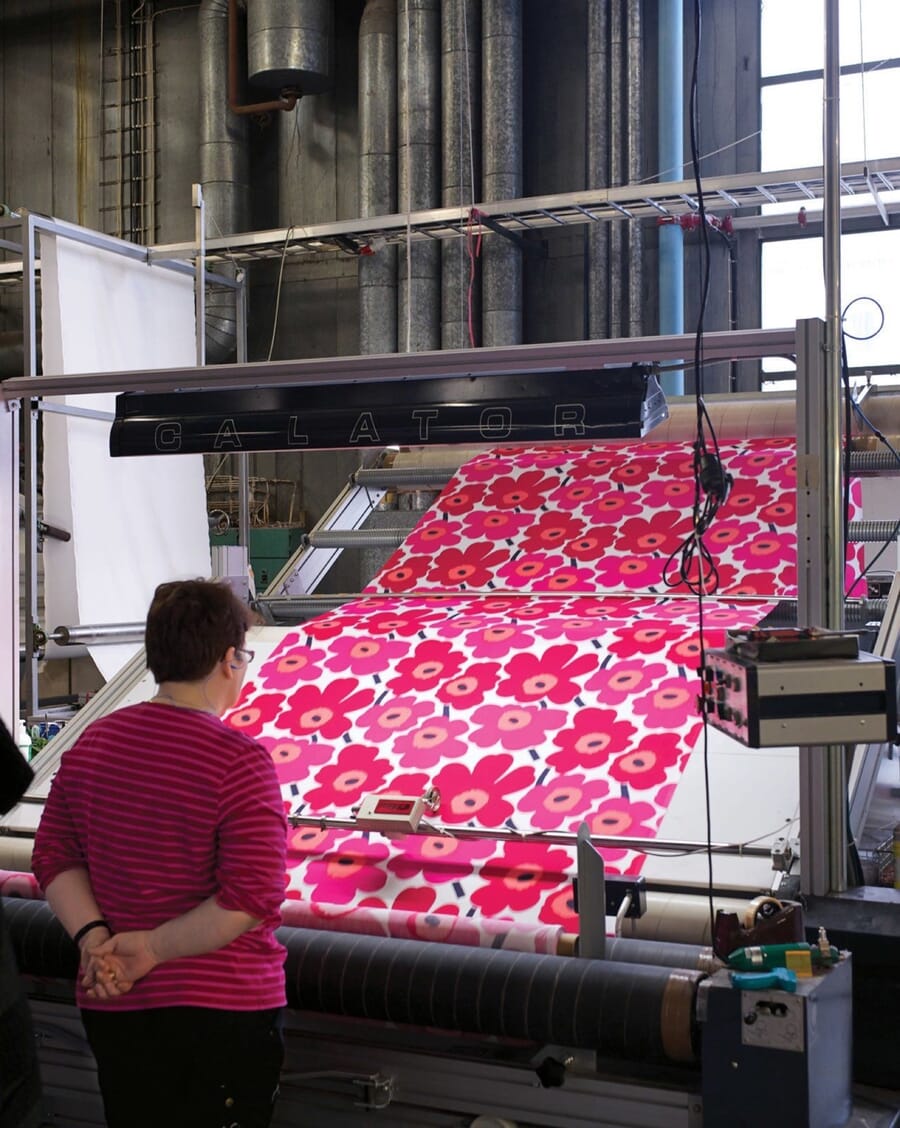 Pink floral fabric coming off a printing line
