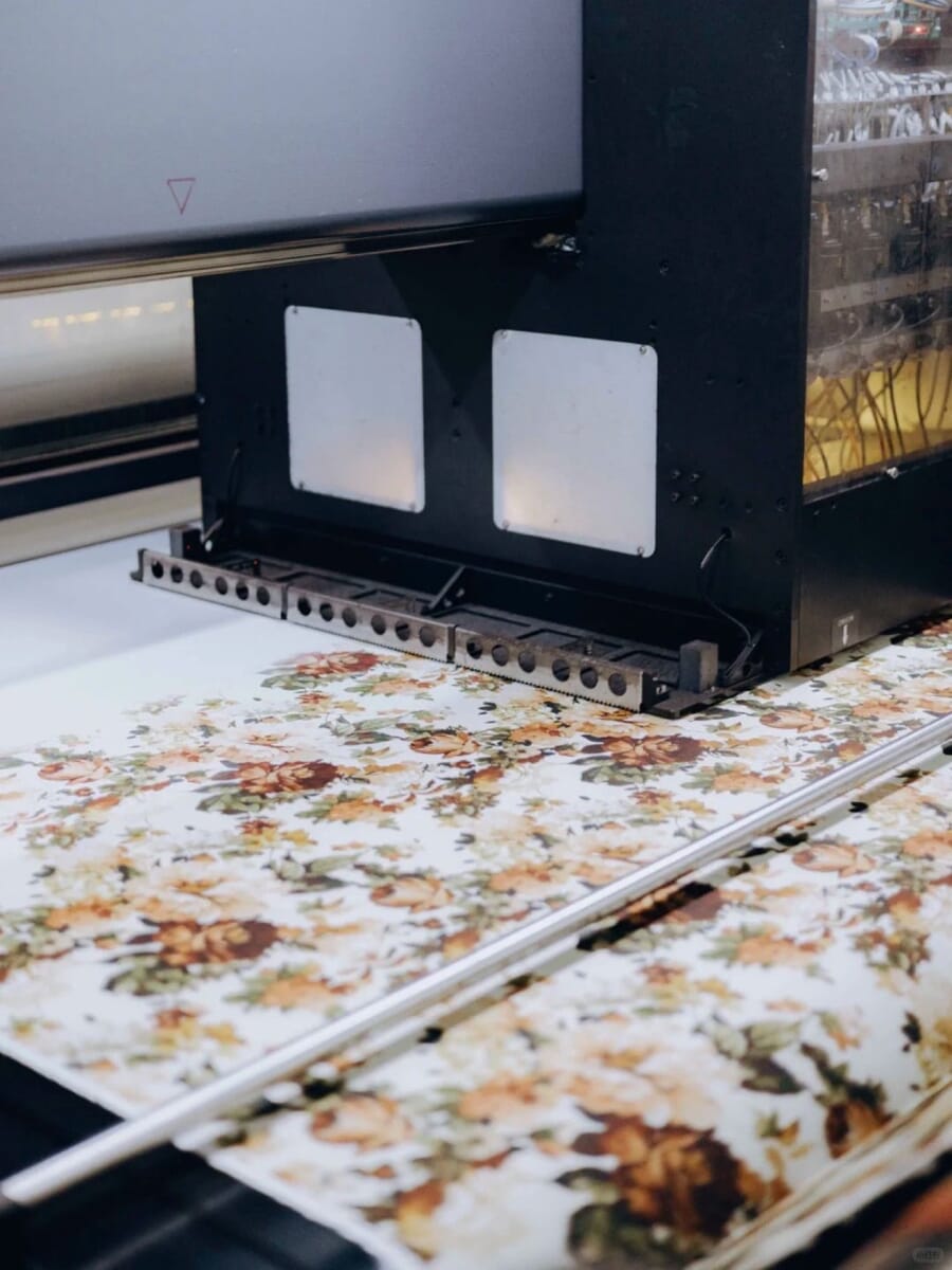 Floral print coming off a digital fabric printer