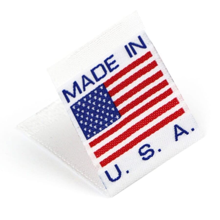 Folded white woven label with a US flag and the words Made in U.S.A.