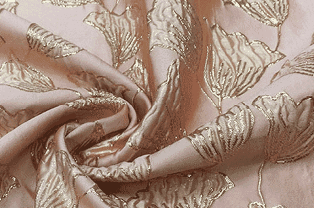 Tone-on-tone damask fabric with a reversible woven motif, used for shirting-weight dresses and blouses.