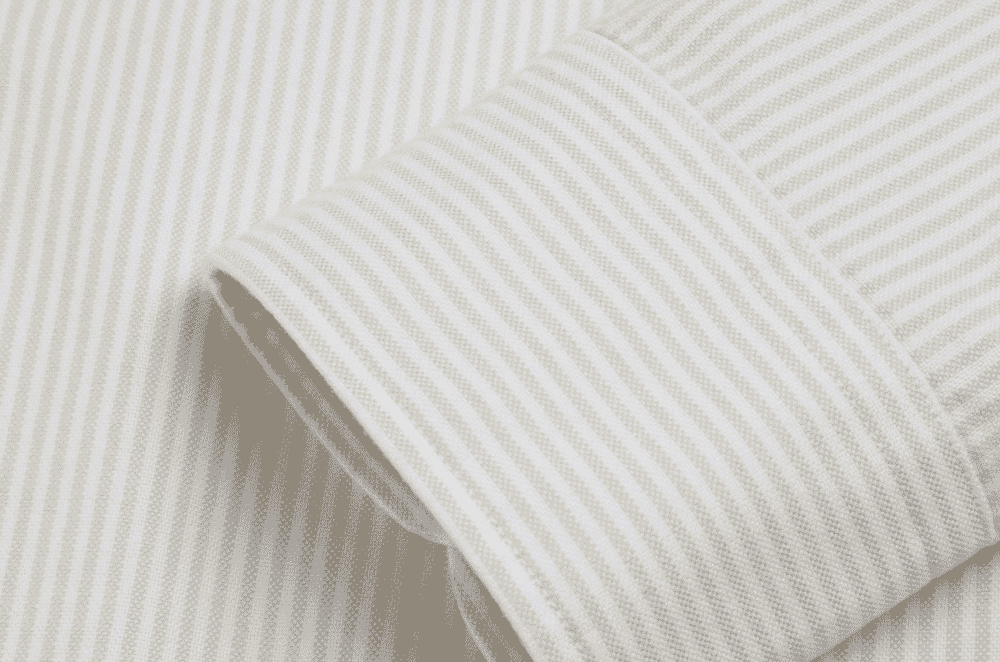 Textured oxford basket-weave shirting fabric showing the chunkier surface typical of casual button-down shirts.