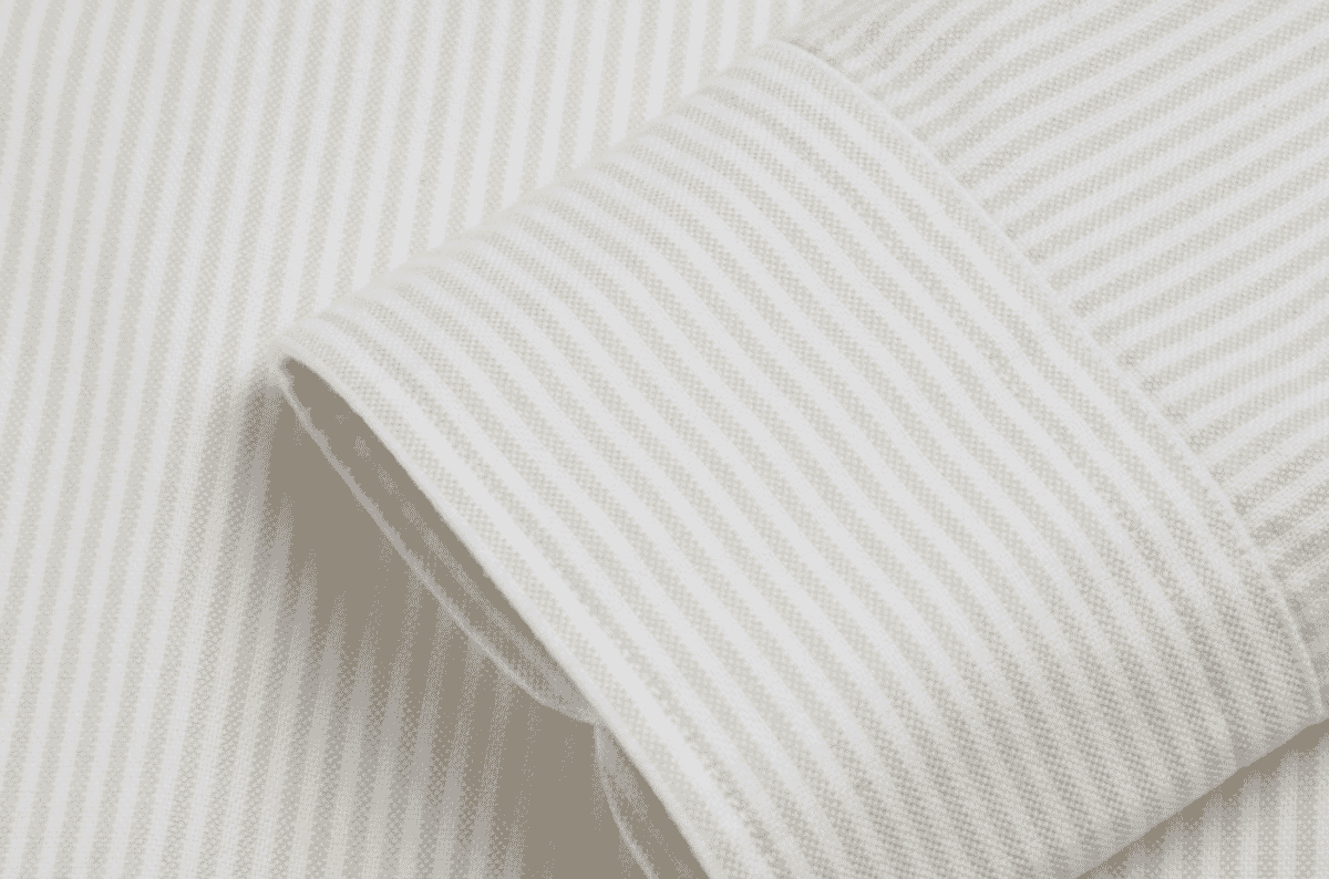 Textured oxford basket-weave shirting fabric showing the chunkier surface typical of casual button-down shirts.