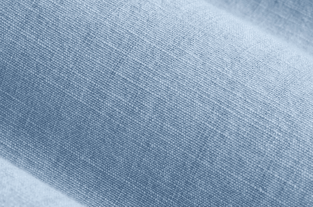 Soft heathered chambray fabric with a coloured warp and white weft, giving a lightweight denim-like appearance suited to workshirts and summer dresses.