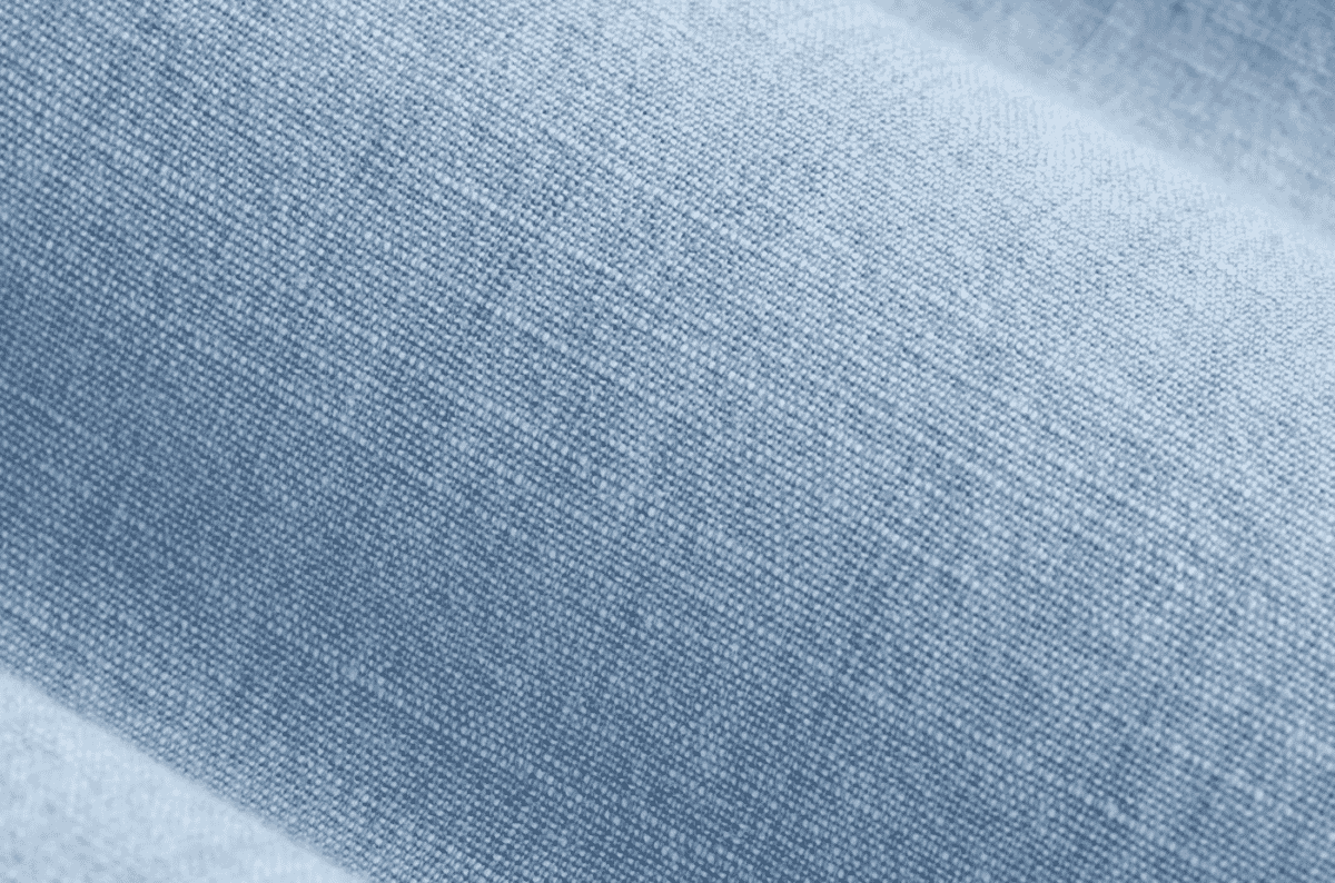Soft heathered chambray fabric with a coloured warp and white weft, giving a lightweight denim-like appearance suited to workshirts and summer dresses.