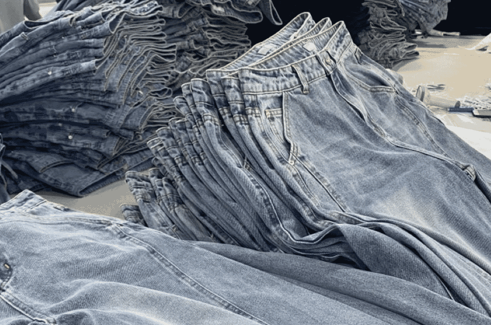 Faux stone wash denim finish produced with chemical treatment only, showing a flatter, muted fade.