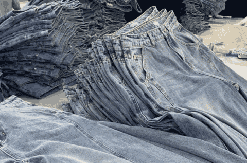 Piles of washed jeans before finishing