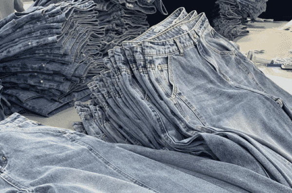 Piles of washed jeans before finishing