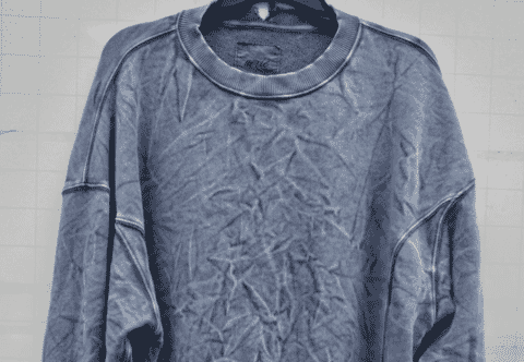 Washed blue sweatshirt with exposed seams