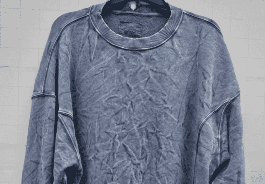 Washed blue sweatshirt with exposed seams