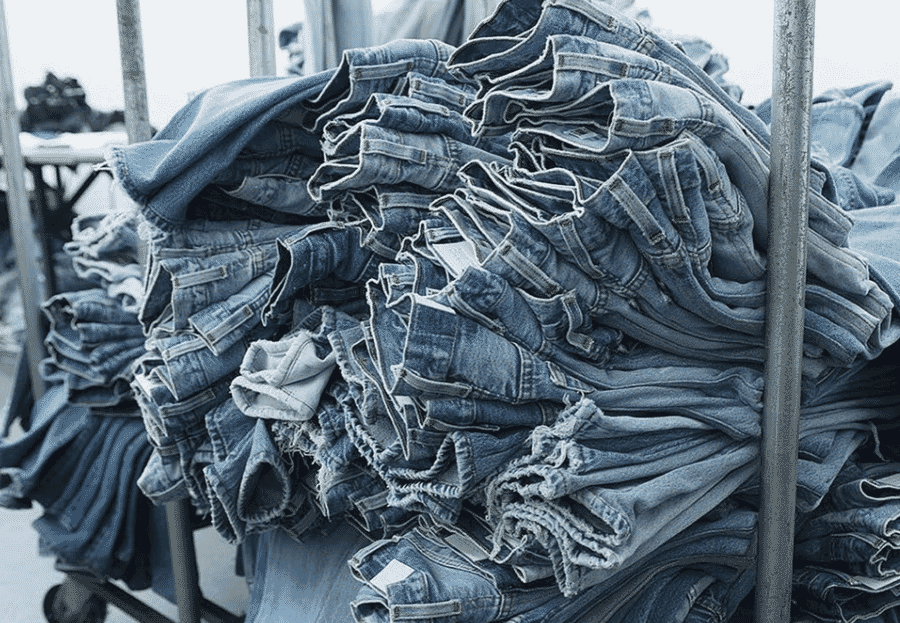 Stack of washed jeans ready for finishing