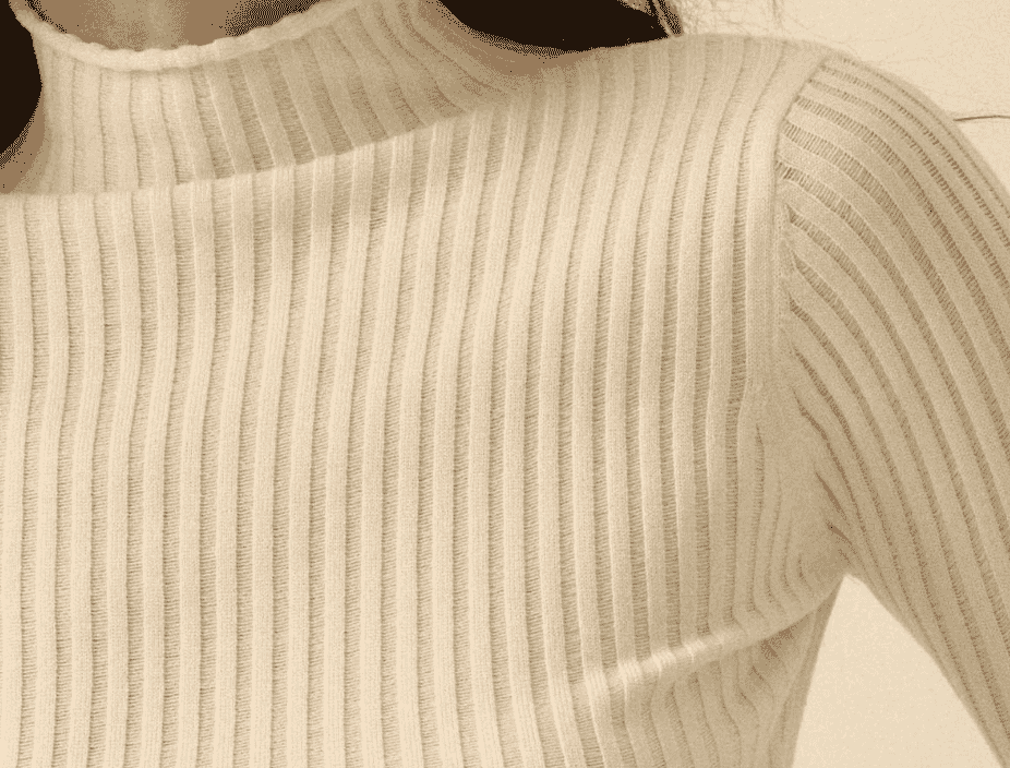 Drop-needle rib knit fabric showing widened, textural columns produced by skipped needles in the knitting sequence.
