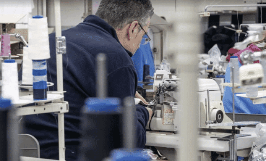 Operator sewing on an industrial machine