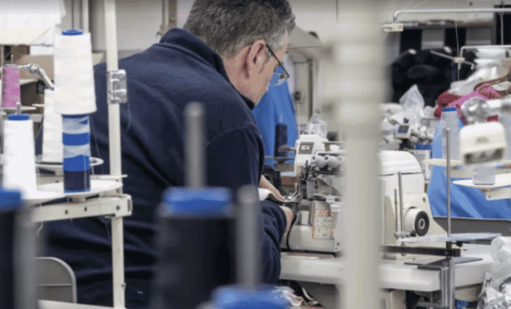 Operator sewing on an industrial machine