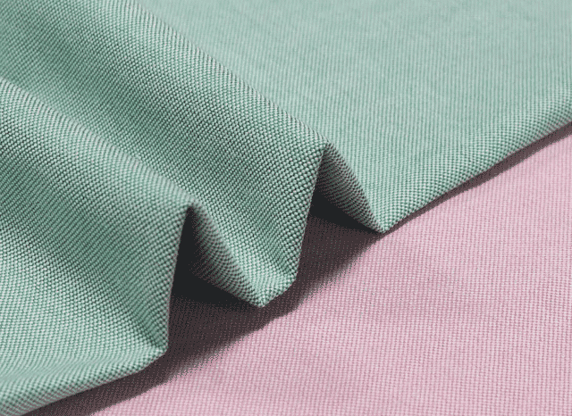 Tecido oxford verde e rosa sobrepostos