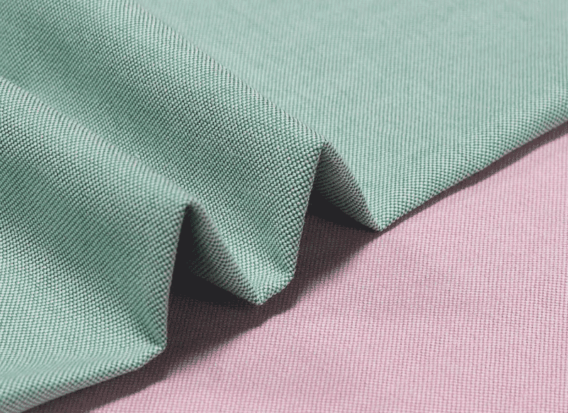 Tecido oxford verde e rosa sobrepostos